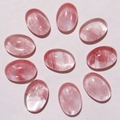 Nine oval pink quartz gemstone cabochons arranged in a circle for DIY jewelry - Watermelon Red (Synthetic)