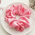 Pink satin oversized hair scrunchie with glossy pleated fabric on white relief plate - Large Peach Pink
