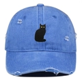 Close-up of distressed washed blue denim baseball cap featuring black cat embroidery - Light Blue