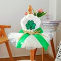 Detail of pet holiday tutu dress featuring green glitter shamrocks and silk bow on a mannequin - XS / Clover Mesh Dress