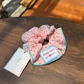 Pink polka dot scrunchie with Keep Love woven label and baby blue stitched edging - Pink Scrunchie with Blue Trim and Pink Polka Dots