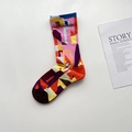 Detailed close-up of a cotton crew sock with colorful abstract geometric patterns - Abstract Patchwork