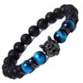 Detailed shot of wolf head beaded bracelet with blue tiger eye and black volcanic stones - Lava Stone + Blue Tiger Eye