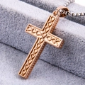 Close-up of rose gold stainless steel cross pendant with intricate textured patterns - Pendant Only / Rose Gold