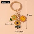 Detailed view of sunflower and bee enamel pendants with precise dimensions and weight measurement - Sunflower Sun