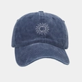 Close-up of navy washed cotton baseball cap featuring detailed white sunflower embroidery - Adjustable / Navy Blue