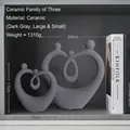 Modern dark grey abstract ceramic character figurines for Nordic home decor - A Family Of Three Heart-shaped Frosted Decorative Piece In Dark Gray.
