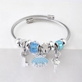 Detail of silver beaded bracelet with blue glitter charms and a ballerina pendant - C2-001 Blue