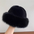 Thick black faux fur bucket hat for winter featuring a plush texture and warm round top design - Black