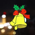 Christmas window sticker featuring yellow bells with red bow and green holly leaves - Bell