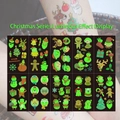 Luminous Christmas tattoo stickers showing Santa and gingerbread man on skin - Luminous Christmas Tattoos (Y021-030)