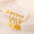 Detailed macro view of a 6-piece gold-plated stainless steel earring set with orange enamel - 3 Pairs Orange Yellow Enamel Oval Set