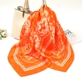 Detail of orange paisley silk scarf tied to a cream handbag with floral patterns - 70-70cm / Orange Paisley (FJ016-8)