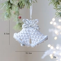 White flocked Christmas bell ornament with silver glitter and ribbon hanging on tree - 3D Bell