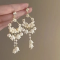 Close-up of golden tassel earrings with white pearls and lily of the valley floral design - 3# Silver Earring Post - Gold Lily of the Valley Pearl Tassel