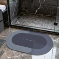 Oval dark grey diatomaceous earth bath mat with white HOME text and anti-slip backing - Lake Baikal (oval) - Blue (patented Coating)