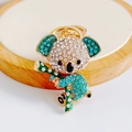 Close-up of sparkling koala keychain with blue and white rhinestones on wooden base - Pendant Only / Blue
