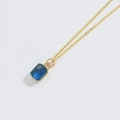 Elegant gold chain necklace featuring a rectangular dark blue zircon gemstone pendant - Sapphire Blue