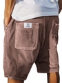 Close-up of brown corduroy shorts featuring striped texture and rear pocket label detail - S / Bottoms / Pink