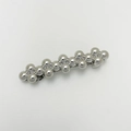 Detail of silver metallic hair clip with connected spherical beads in a punk style - Beaded Dot Silver