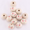 Natural 20mm round wooden beads with happy smiley face and red blush patterns - Squinting Smile