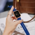 Chic rose gold square watch with blue silicone strap shown on a woman wrist - Blue Strap Rose Gold Case