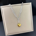 Golden heart pendant on silver paperclip chain necklace displayed in a beige jewelry box - H1305 Heart Necklace Two-tone