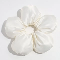 Close-up of white satin oversized flower scrunchie showing glossy texture and petal detail - White (Approx. 18cm)