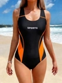 Detailed view of black and orange one-piece swimsuit with visual slimming side panels - 3XL / Orange Stripe