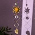 Detailed close-up of golden lotus flower suncatcher with amethyst crystal stones - Citrine
