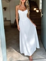 Detail of white A-line dress with spaghetti straps and ruched corset waist design - S / White