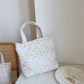 Detailed macro view of pink floral quilted cotton tote bag with Simple Wish woven label - Light Green Pink Grid Small Flower