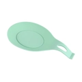 Light green food grade silicone spoon rest for spatulas and ladles on white background - Green