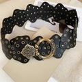 Close-up of vintage waist chain with wave-edge discs and golden rivet details - Black