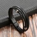 Close-up of black braided leather bracelet with multi-layer metal beads and magnetic clasp - Black