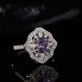 Macro shot of oval amethyst ring with hollow petal halo and sparkling diamonds - Retro Hollow Floral Style (LR312)