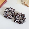 Set of two leopard print satin scrunchies with elegant silk texture on white desk - Beige Leopard