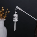 Detailed close-up of hollowed silver flower hair stick with long elegant tassels - Silver/F189/Artistic Butterfly Tassel