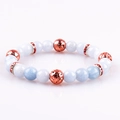 Elastic 8mm light blue natural stone bracelet with bronze lava beads and red crystals - Aquamarine