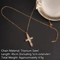 Titanium steel cross necklace featuring multi-color cubic zirconia on black leather background - Cross No.19 Gold (A1006)