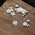 Detail of bridal hair comb set with white ceramic flowers and pearls on wooden surface - Set 1 (4pcs) / White+Silver