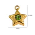 Macro detail of a 9mm star pendant in 14K gold stainless steel with green stone - Fruit Green Zirconia