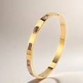 Detailed macro view of a gold titanium steel bracelet featuring rectangular zircon stones - Gold White Rhinestone