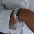 Textured silver cuff bracelet with S925 engraved tag on female model wrist - Bracelet-2cm / Steel