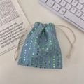 Detail of light blue denim drawstring pouch with green sequins and distressed fraying edge - Denim Sequin (Small)