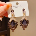 Detailed close-up of S925 silver needle heart drop earrings with purple crystals - Gold-Purple-Flower Dangle