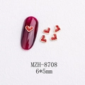 Detailed view of 6x5mm red heart nail art charms with golden alloy base on a white surface - Gold Heart Red Rhinestone Style(8708)