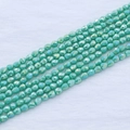 Macro detail of mint green faceted teardrop glass beads with AB aurora luster - 4*5mm (Approx 95pcs/strand) / Turquoise Green AB