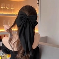 Fermaglio per capelli con fiocco di raso nero oversize e nappe lunghe per donna elegante - Nero