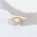 Macro shot of gold twisted ring with micro-pave white zircon stones and open band detail - Spiral Style